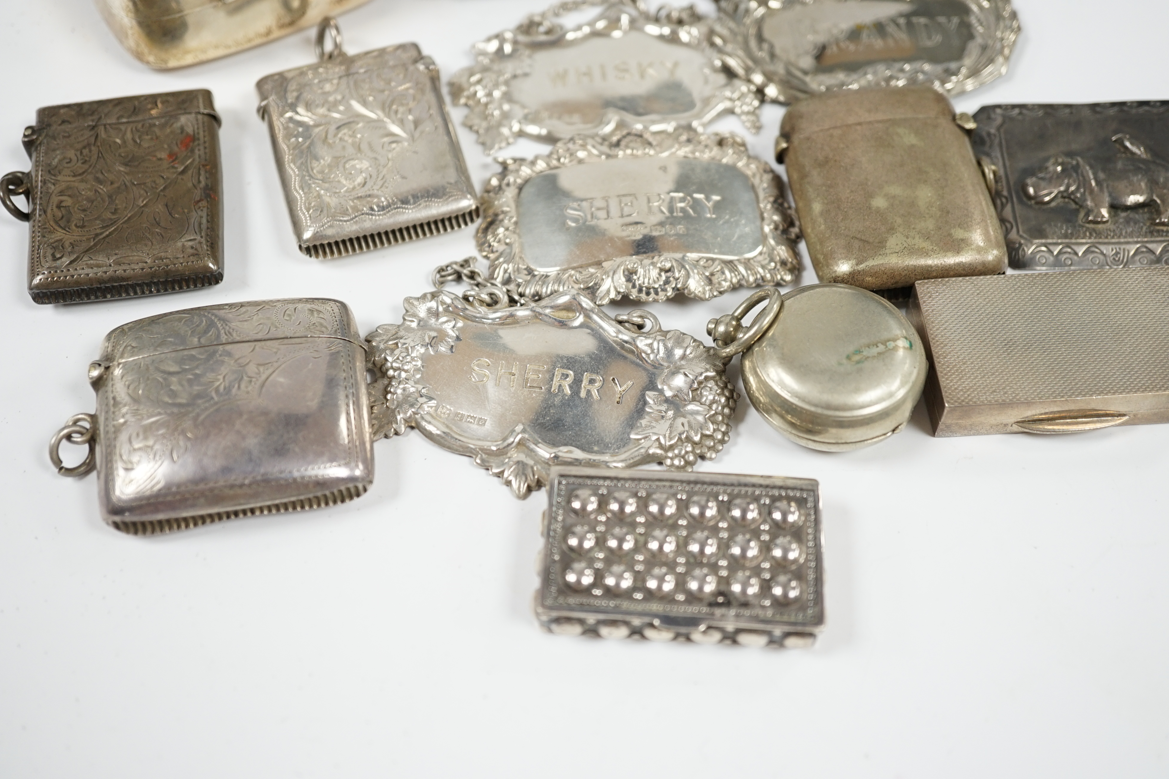 Sundry small silver and plated items including wine labels, vest cases, sovereign case and a Victorian silver snuff box, London, 1841, 79mm. Condition - poor to fair to good